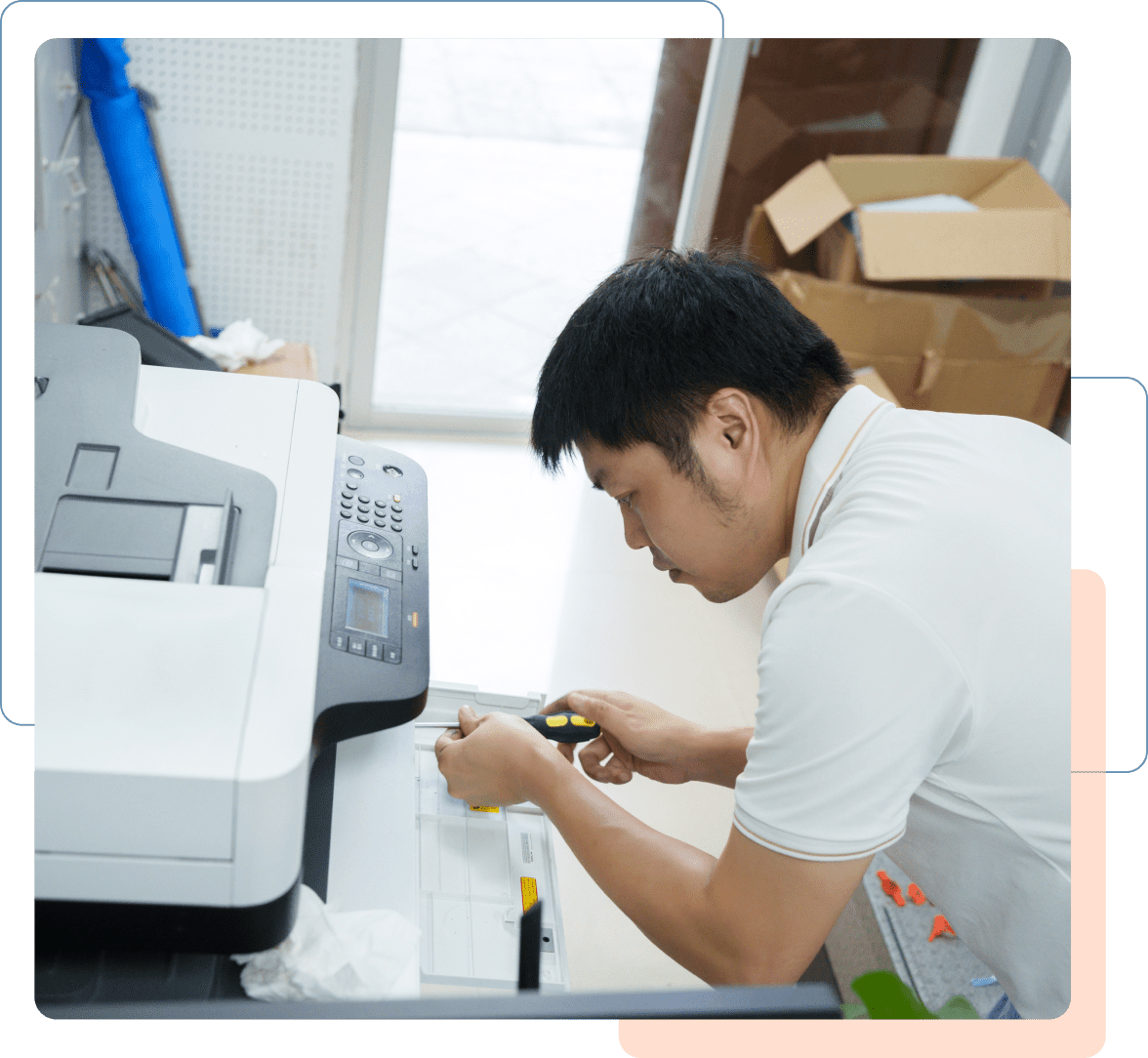 Group 1 Person measuring paper near a printer.